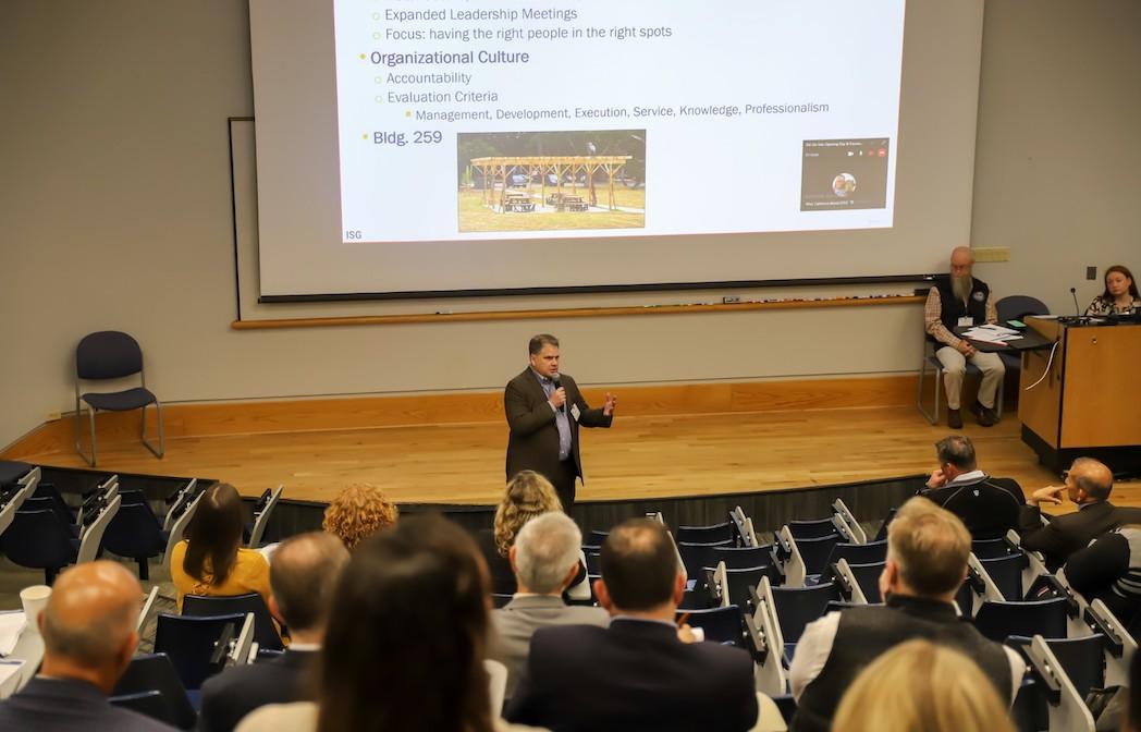 picture of a man in a suit giving a presentation
